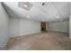 Spacious unfinished basement featuring a stone fireplace, offering room for customization at 1460 Bakers Bridge Rd, Douglasville, GA 30134