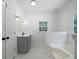 Well-lit bathroom features a granite vanity, tile flooring, and a shower-tub combination at 1460 Bakers Bridge Rd, Douglasville, GA 30134
