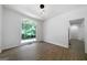 Bedroom featuring hardwood floors, a large window, and ample natural light at 1460 Bakers Bridge Rd, Douglasville, GA 30134