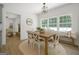 Eat in kitchen with lots of natural light, with a wood table and chairs, and hardwood floors at 1460 Bakers Bridge Rd, Douglasville, GA 30134