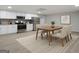Bright basement kitchen featuring stainless steel appliances and dining area at 1460 Bakers Bridge Rd, Douglasville, GA 30134