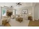 Comfortable living room with fireplace, neutral decor, and ample seating perfect for relaxation and entertainment at 1460 Bakers Bridge Rd, Douglasville, GA 30134