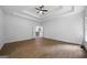 Bright and spacious open living room with wood floors and a view into the stylish kitchen at 1460 Bakers Bridge Rd, Douglasville, GA 30134