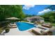 Enjoy the backyard pool area with lounge chairs, and outdoor furniture for relaxing and entertaining at 1460 Bakers Bridge Rd, Douglasville, GA 30134