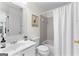 Bathroom featuring white cabinets, sink, toilet, bathtub, and a shower with grey tile at 1602 Cascade Overlook, Peachtree City, GA 30269