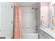 Bathroom featuring a white vanity, bathtub with shower, and pink curtain at 1602 Cascade Overlook, Peachtree City, GA 30269
