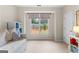 Cozy bedroom with a bed, ample natural light, and neutral colored walls and carpet at 1602 Cascade Overlook, Peachtree City, GA 30269