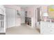 Pink bedroom featuring a double door closet, shelves, dresser, and carpet at 1602 Cascade Overlook, Peachtree City, GA 30269