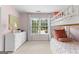 Pink bedroom featuring a bunk bed, dresser, window with curtains, and carpet at 1602 Cascade Overlook, Peachtree City, GA 30269