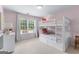 Pink bedroom featuring a bunk bed, dresser, window with curtains, and carpet at 1602 Cascade Overlook, Peachtree City, GA 30269