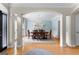 Elegant dining room with chandelier, hardwood floors, and ample natural light at 1602 Cascade Overlook, Peachtree City, GA 30269
