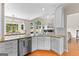 Bright kitchen with stainless steel appliances, granite counters, and view to backyard at 1602 Cascade Overlook, Peachtree City, GA 30269