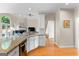 Kitchen featuring granite countertops and view of the fireplace and living room at 1602 Cascade Overlook, Peachtree City, GA 30269