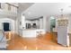 Spacious open-concept kitchen and dining area with hardwood floors and modern appliances at 1602 Cascade Overlook, Peachtree City, GA 30269