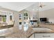 Sun-filled living room with vaulted ceiling, fireplace, and granite island with sink at 1602 Cascade Overlook, Peachtree City, GA 30269
