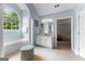 Main bathroom featuring a tub under a large window and separate vanity at 1602 Cascade Overlook, Peachtree City, GA 30269