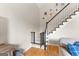 View of a staircase with wood and carpet steps and white railing with a baby gate at 1602 Cascade Overlook, Peachtree City, GA 30269
