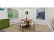 Cozy dining area with a wood table, four chairs, and art displayed on the wall at 1239 Teakwood Trl, Stone Mountain, GA 30083