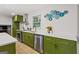 Bright kitchen featuring olive green cabinets, stainless steel appliances, and white countertops at 1239 Teakwood Trl, Stone Mountain, GA 30083