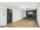 Spacious living room with a brick fireplace and modern flooring at 1239 Teakwood Trl, Stone Mountain, GA 30083