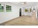 Open living area featuring large windows, modern flooring and access to other living spaces at 1239 Teakwood Trl, Stone Mountain, GA 30083