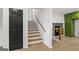 Staircase with wooden steps and railing, connecting different levels of the home at 1239 Teakwood Trl, Stone Mountain, GA 30083