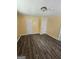 Bedroom featuring new wood look vinyl flooring, two entry doors, and neutral paint at 2670 Foxlair Trl, South Fulton, GA 30349