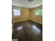 Bedroom with wood-look flooring and natural light streaming through windows at 2670 Foxlair Trl, South Fulton, GA 30349