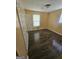 Well-lit bedroom with dark wood floors, neutral walls, and two windows for natural light at 2670 Foxlair Trl, South Fulton, GA 30349