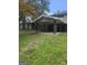 Home featuring large carport, brick facade, and a spacious yard at 2670 Foxlair Trl, South Fulton, GA 30349