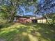 Brick home with a large yard and mature trees offering shade and curb appeal at 2670 Foxlair Trl, South Fulton, GA 30349