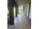 Charming front porch with patterned tile flooring and brick archways, perfect for relaxing outdoors at 2670 Foxlair Trl, South Fulton, GA 30349