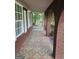 Charming front porch with patterned tile flooring and brick archways, perfect for relaxing outdoors at 2670 Foxlair Trl, South Fulton, GA 30349