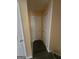 Hallway featuring a closet with white doors and neutral-painted walls for storage and access to other areas at 2670 Foxlair Trl, South Fulton, GA 30349