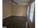 Spacious living room with new dark vinyl wood flooring, complemented by bright windows and natural light at 2670 Foxlair Trl, South Fulton, GA 30349