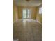 Sunlit living room featuring tiled floors and double doors leading to the exterior at 2670 Foxlair Trl, South Fulton, GA 30349