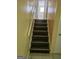 Staircase with wooden steps and a handrail, leading to the upper level of the home at 2670 Foxlair Trl, South Fulton, GA 30349