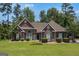 Charming brick home with green shutters and a well-manicured lawn at 2928 Mandy Ct, Jonesboro, GA 30236