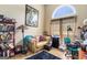 Comfortable living room offering a gold leather sofa, reading nook, decorative lighting, and a modern work space at 2928 Mandy Ct, Jonesboro, GA 30236