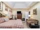 Spacious bedroom featuring vaulted ceilings, a large bed, and comfortable sitting area for relaxing and watching television at 2928 Mandy Ct, Jonesboro, GA 30236