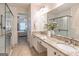 Bathroom featuring double sink vanity with granite counters, tile floor, and a glass-enclosed shower at 370 Grand Teton Cir, Fayetteville, GA 30215