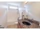 Well-lit bathroom features granite counters, modern sink, and shower-tub combo with neutral tile at 370 Grand Teton Cir, Fayetteville, GA 30215