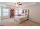 Serene bedroom with tray ceiling, ceiling fan, and ample natural light at 370 Grand Teton Cir, Fayetteville, GA 30215
