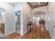 Inviting foyer showcasing hardwood floors and view into the open floorplan of the living spaces beyond at 370 Grand Teton Cir, Fayetteville, GA 30215