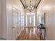 Elegant foyer features hardwood floors, decorative ceiling, and a chandelier creating a grand and inviting entrance at 370 Grand Teton Cir, Fayetteville, GA 30215
