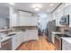 Bright kitchen with white cabinetry, stone countertops, and stainless steel appliances at 370 Grand Teton Cir, Fayetteville, GA 30215
