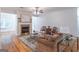 Bright living room with a fireplace, hardwood floors, and elegant furnishings at 370 Grand Teton Cir, Fayetteville, GA 30215