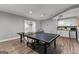Game room featuring a ping pong table and a snack bar with white cabinets at 55 Jolie Ln, Sharpsburg, GA 30277