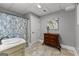 Bathroom featuring a tiled floor, decorative wall art and a marble vanity with a modern faucet at 55 Jolie Ln, Sharpsburg, GA 30277