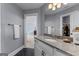 Bathroom vanity features neutral walls and granite countertops with an entrance to the adjacent bedroom at 55 Jolie Ln, Sharpsburg, GA 30277
